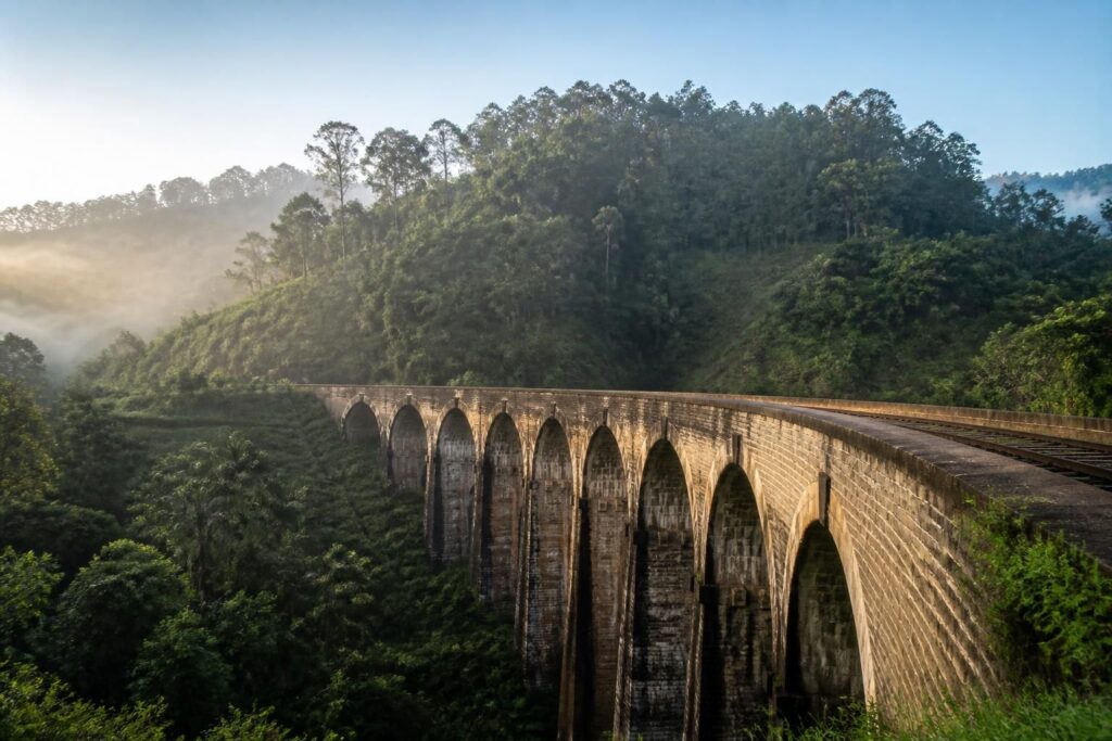 découvrez le mythique pont aux neuf arches au sri lanka, une merveille architecturale nichée dans un paysage naturel spectaculaire, idéale pour les amateurs de randonnée et d'histoire.